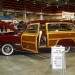 vintage 1949 Ford woody wagon at indoor car show thumbnail