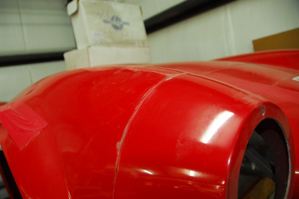 close up of unfinished body lines on a cobra kit car