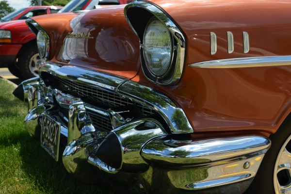 close up of front bumper and headlight on a 1957 chevy