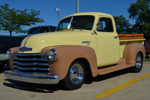vintage chevy 3100 pickup truck in parking lot