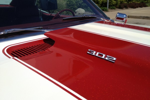 close up of 302 emblem on hood of a chevy camaro z/28