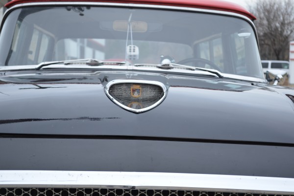 close up of hood badge on a 1958 ford ranch wagon