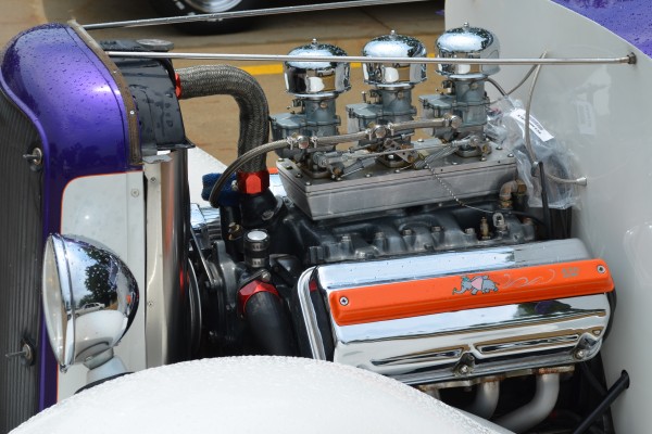 vintage hemi engine with six pack setup in an old hotrod