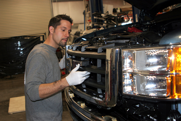 removing the grille of a GMC truck