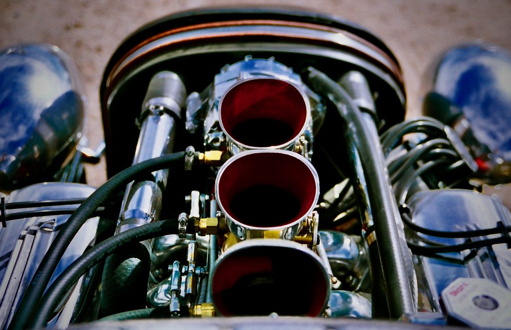 a look down the triple velocity stacks of a hotrod v8 engine