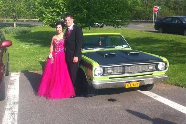 1970 Plymouth Duster with prom couple