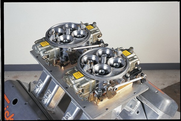 dual quad carburetors atop a v8 engine