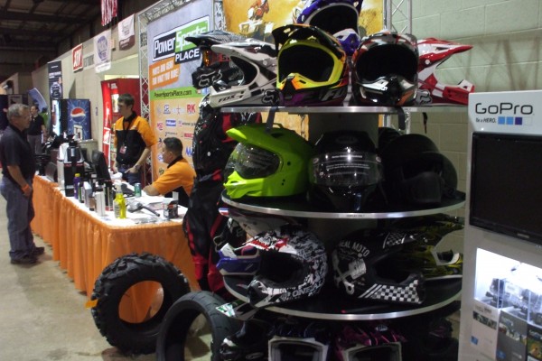 motorcycle helmets in an automotive trade show display