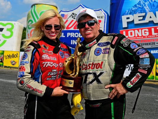 courtney and john force with nhra wally trophy