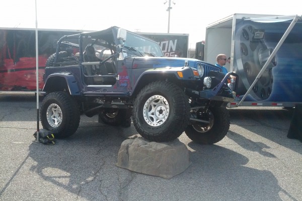 jeep wrangler tj showing articulation flex in booth display