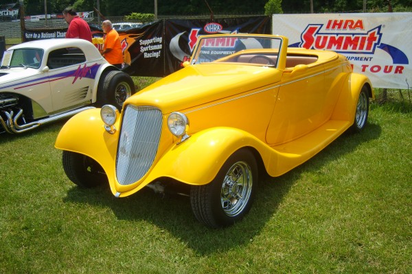 yellow ford fendered coupe hot rod
