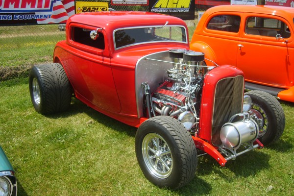 red vintage ford 3 window hot rod coupe