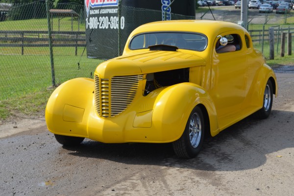 yellow ford prewar coupe hot rod