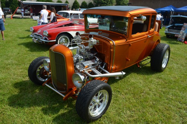 orange ford five window hot rod coupe