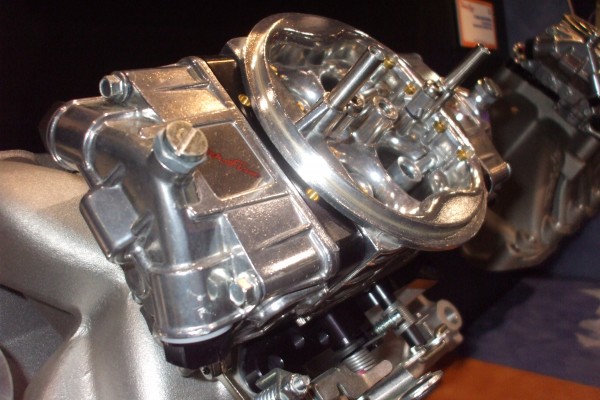 close up of carburetor at an automotive trade show