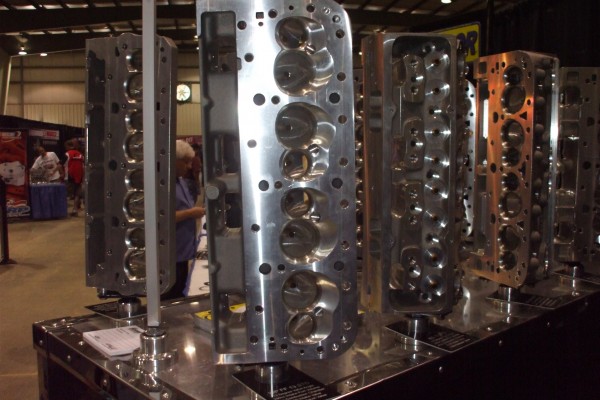 cylinder heads displayed at an automotive trade show