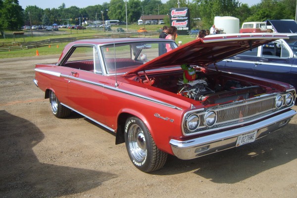 vintage dodge coronet muscle car at a large event