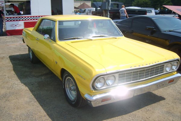 yellow chevy chevelle first gen coupe