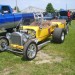 a yellow t bucket ford hot rod pulling a matching trailer thumbnail