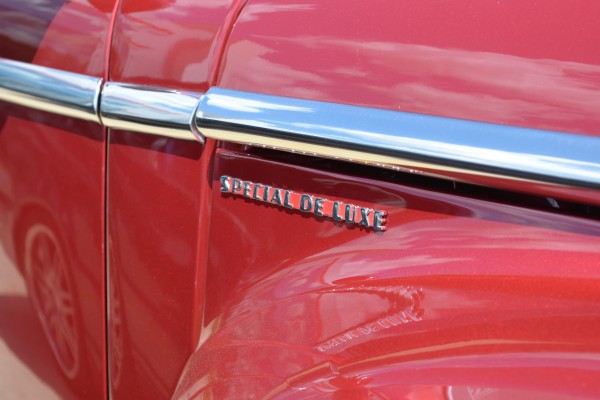 special deluxe badge on a 1947 plymouth hot rod coupe
