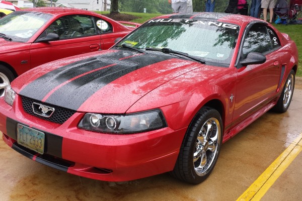 new edge ford mustang at a car show
