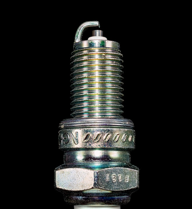 close up of spark plug threaded end and electrode