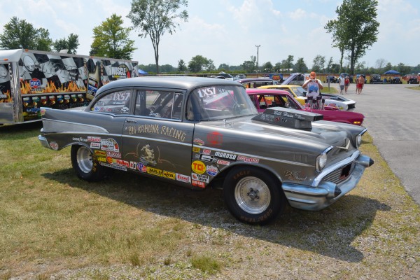 1957 chevy drag car parked on grass
