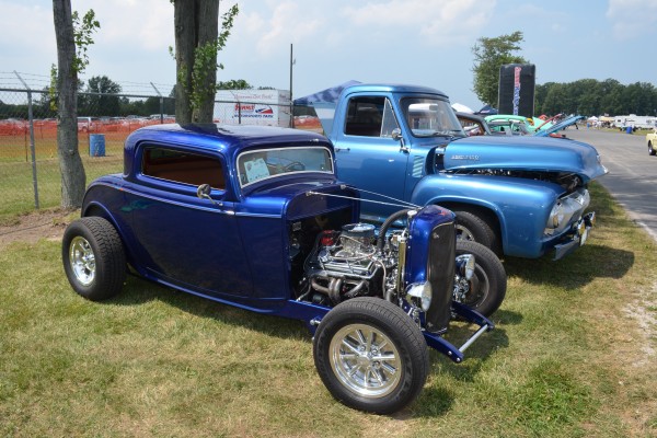 blue ford three window hotrod at a car show