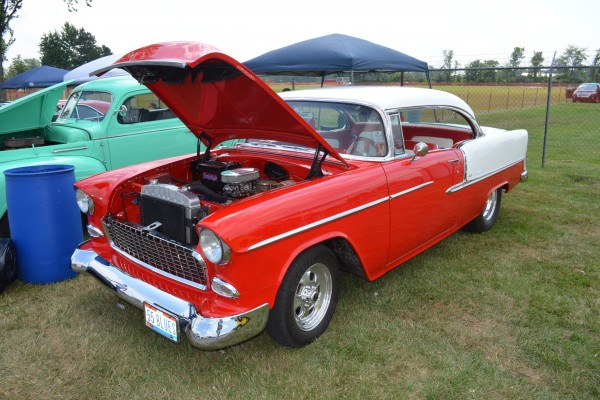 red and white 1955 chevy coupe