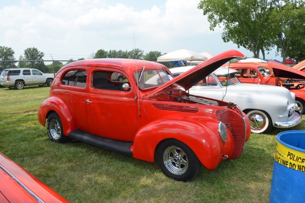 red vintage prewar hot rod coupe at a car show