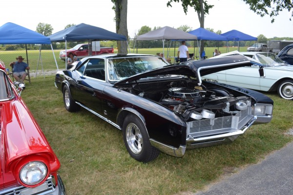 vintage second gen buick Riviera coupe at a car show