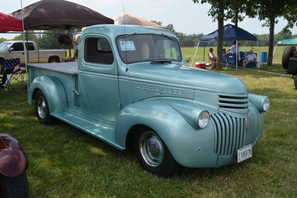 vintage hot rod pickup truck at a car show
