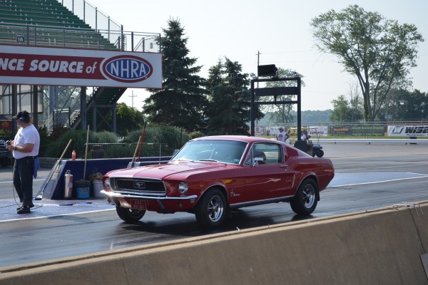 vintage ford mustang fastback coupe on dragstrip
