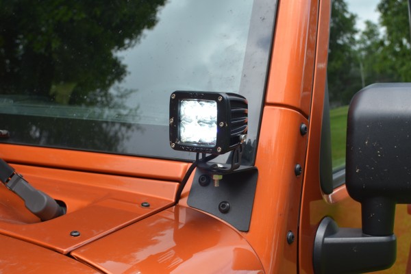 led light pod on a JK wrangler windshield frame