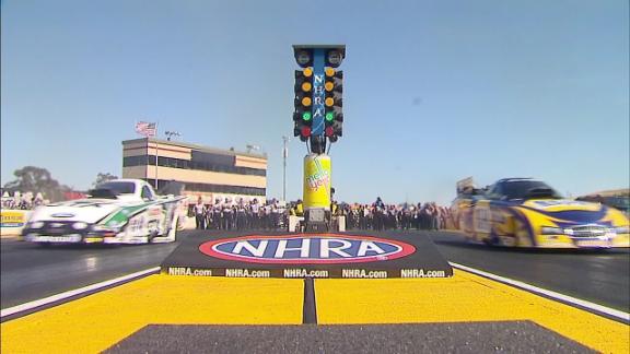 Funny cars launching from Christmas Tree at NHRA Drag Race
