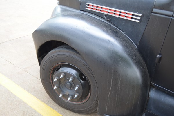 wheel and spiked lugnuts on a vintage dually hot rod truck