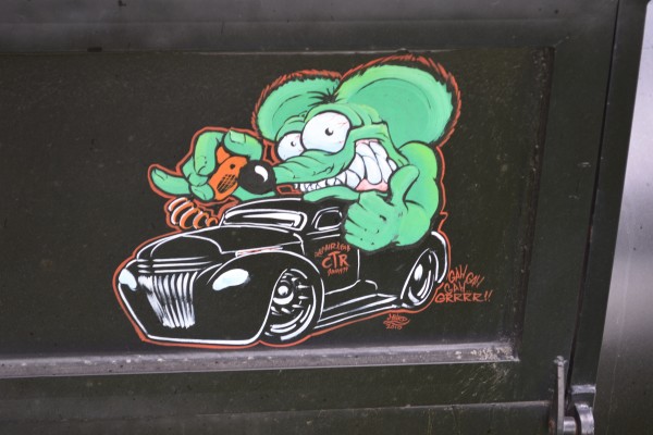 close up of rat fink logo painted on a hot rod