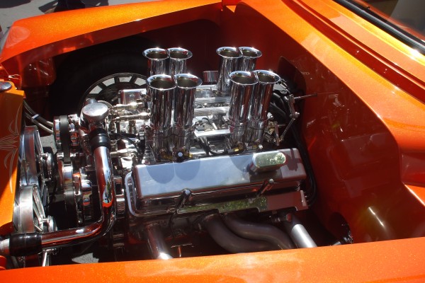 engine with velocity stacks inside a 1954 chevy sedan delivery hot rod