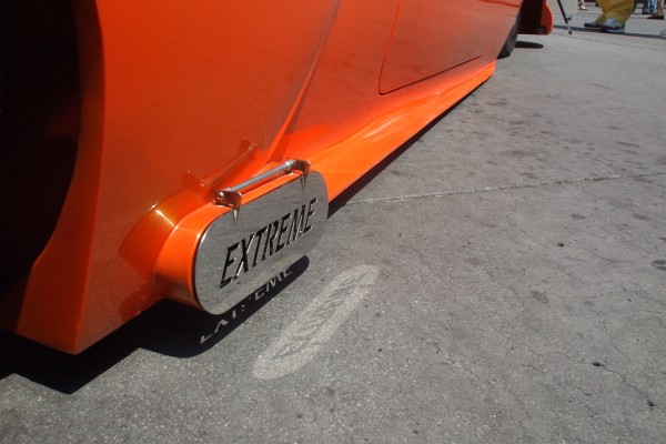 extreme exhaust tip covers on a sedan delivery hot rod