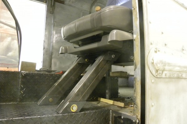 seat brackets installed in a 1949 chevy kurbmaster step van