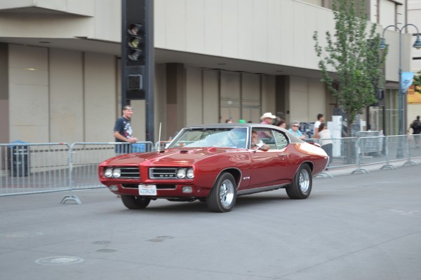 second gen pontiac GTO fastback coupe in parade at Hot August Nights 2013
