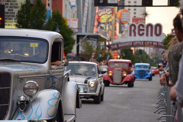 parade of classic hot rods driving down main street in Reno Nevada at Hot August Nights 2013