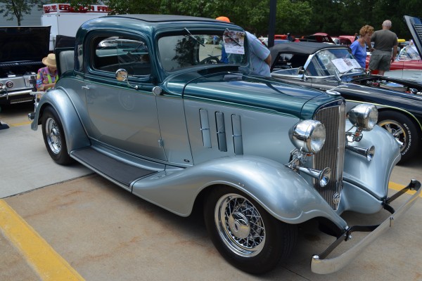 vintage prewar chevy coupe with rumble seat at car show