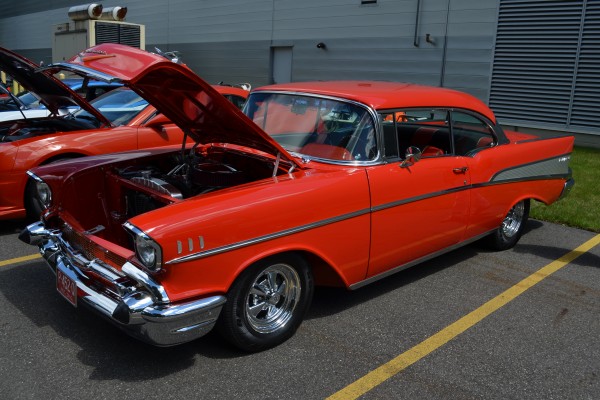 red 1957 chevy bel air coupe at car show, 2013