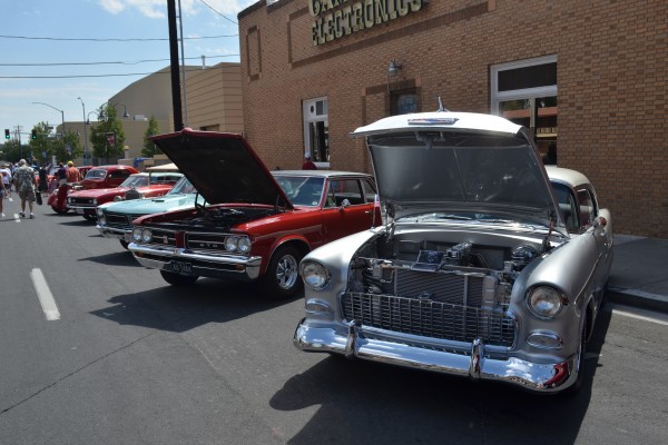 row of classic cars at a cruise in