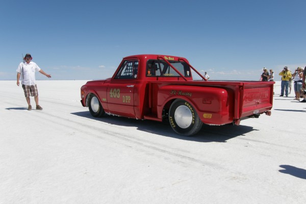 vintage red pickup truck Land Speed Racer at Bonneville Salt Flats during Speed Week