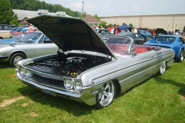 vintage oldsmobile dynamic 88 convertible at a car show