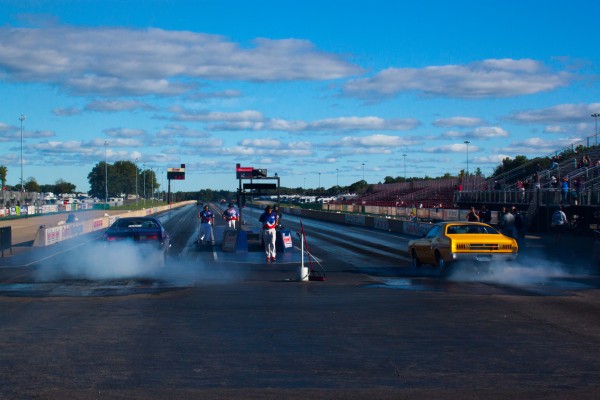 rear view of two cars staging for a drag race