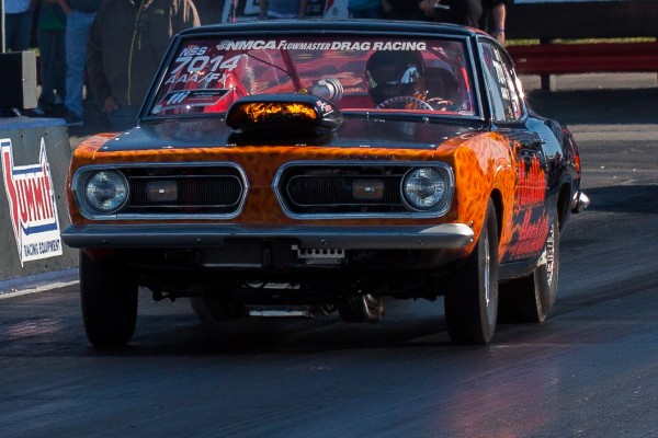 plymouth barracuda muscle car at a drag race track