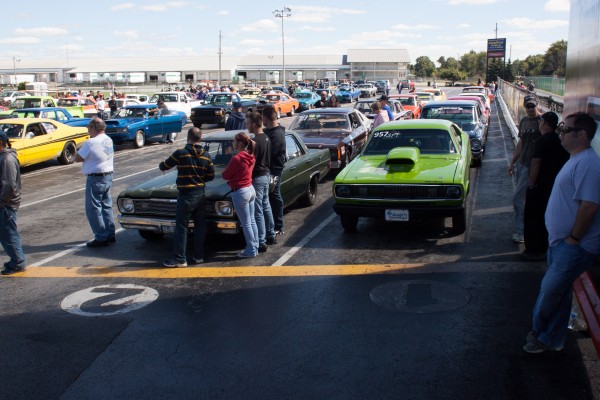 mopar muscle cars in staging lanes of a drag race event